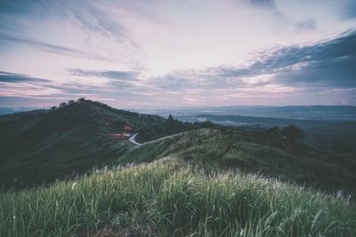 Scenic view of field against sky during sunset