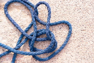 Close-up of rope tied on metal