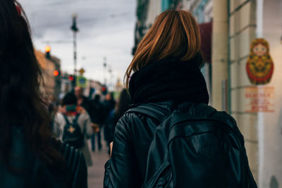Rear view of woman standing outdoors
