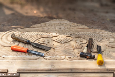 High angle view of work tools on wood