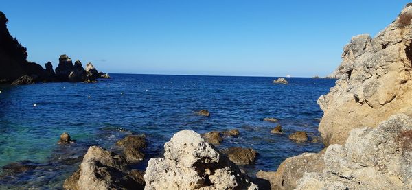 Scenic view of sea against clear sky