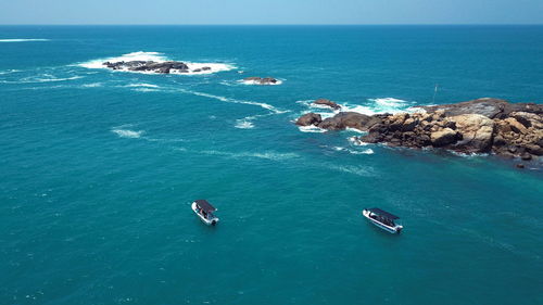 High angle view of rocks in sea