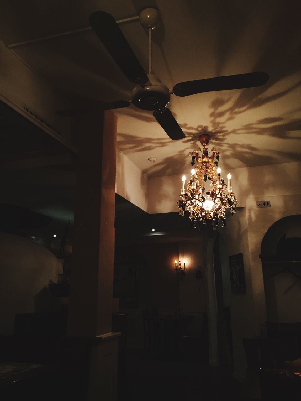 illuminated, lighting equipment, indoors, night, architecture, electric lamp, ceiling, built structure, low angle view, hanging, electric light, electricity, light - natural phenomenon, chandelier, lamp, decoration, lit, no people, home interior, house