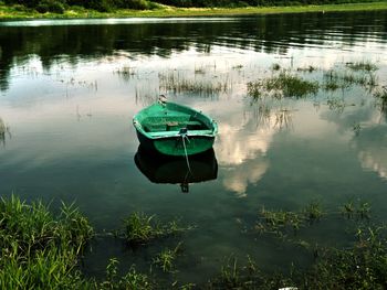 Boat moored in lake