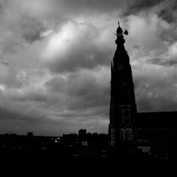 Low angle view of building against cloudy sky