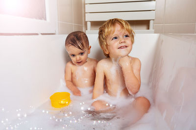 High angle view of young woman in bathtub