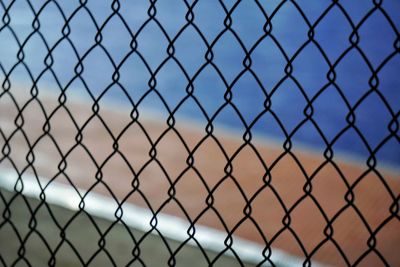 Close-up of chainlink fence against sky