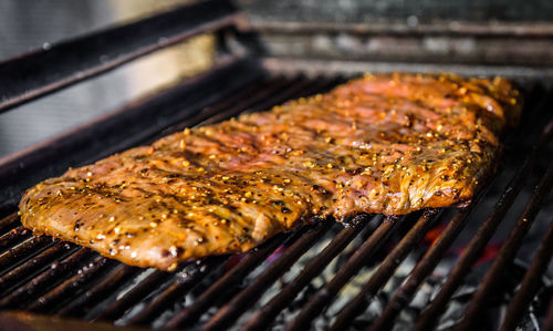 High angle view of meat on barbecue grill