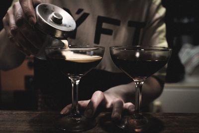 Close-up of wine glasses on table