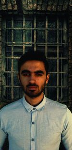 Portrait of young man standing outdoors