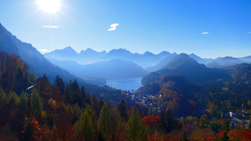 Scenic view of mountains against blue sky