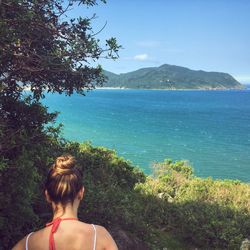 Rear view of woman on beach