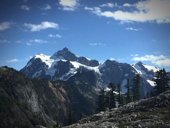 Scenic view of snowcapped mountains against sky
