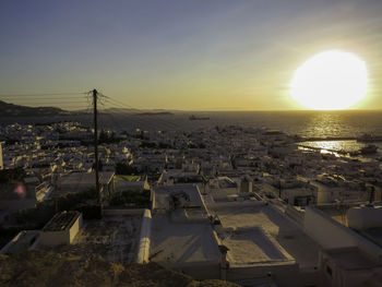 High angle view of townscape against sky during sunset - top of mykonos enjoying sunset