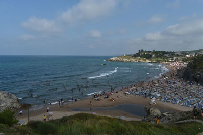 High angle view of people on beach against sky