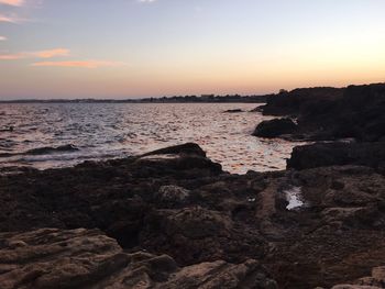 Scenic view of sea against sky at sunset