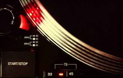 Close-up of telephone booth against black background