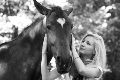 Close-up of woman with horse