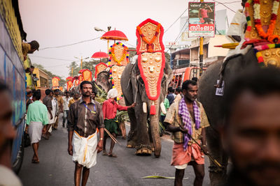 People walking on street in city