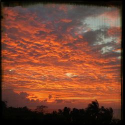 Low angle view of cloudy sky at sunset