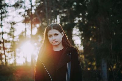 Portrait of young woman in forest