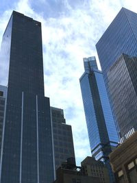 Low angle view of modern buildings against sky