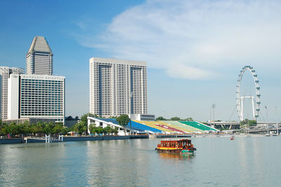 City by river against sky