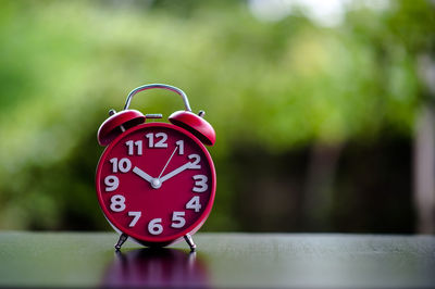 Close-up of clock on table