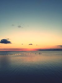 Scenic view of sea against sky at sunset