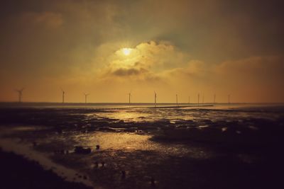 Scenic view of sea against sky at sunset