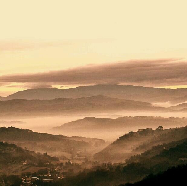 tranquil scene, landscape, scenics, tranquility, mountain, sunset, beauty in nature, mountain range, nature, sky, idyllic, non-urban scene, remote, fog, silhouette, no people, outdoors, horizon over land, tree, dusk