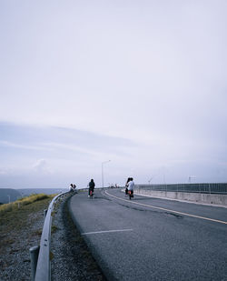 People on road against sky