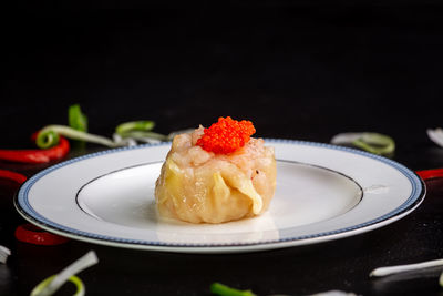 Close-up of dessert served on table