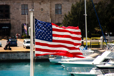 Red flag against boat in water