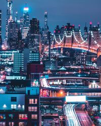 High angle view of illuminated buildings in city at night