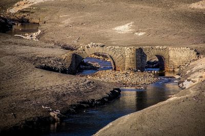 Arch bridge over river