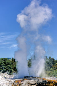 Smoke emitting from volcanic mountain against sky