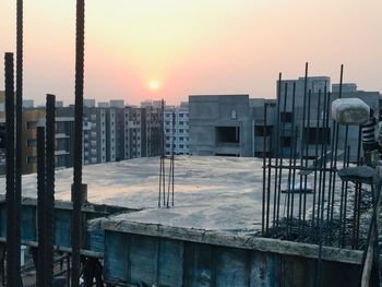 Buildings against sky during sunset