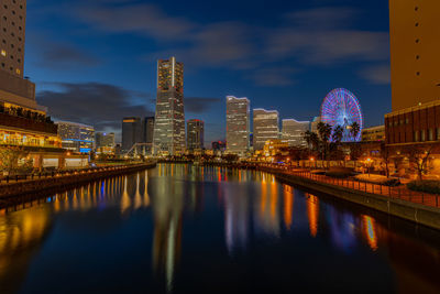 Reflection of illuminated buildings in water