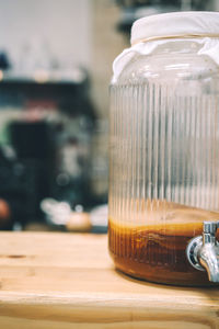 Close-up of glass of jar on table