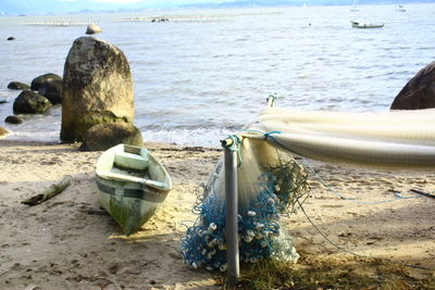 Boats moored on shore at beach