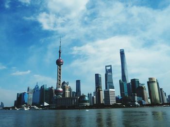 City skyline against cloudy sky