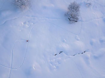 Low angle view of snow on field against sky