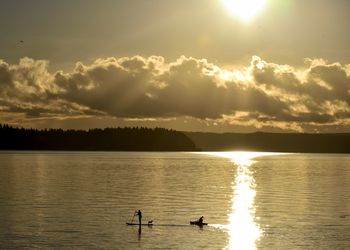 Scenic view of lake at sunset