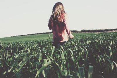 Woman standing on field