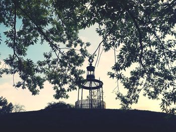 Low angle view of silhouette tree against sky