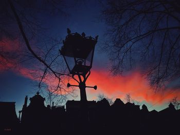 Low angle view of silhouette bare tree against sky at sunset