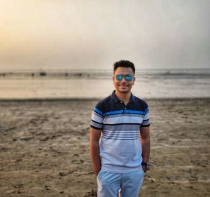 Portrait of boy standing on beach