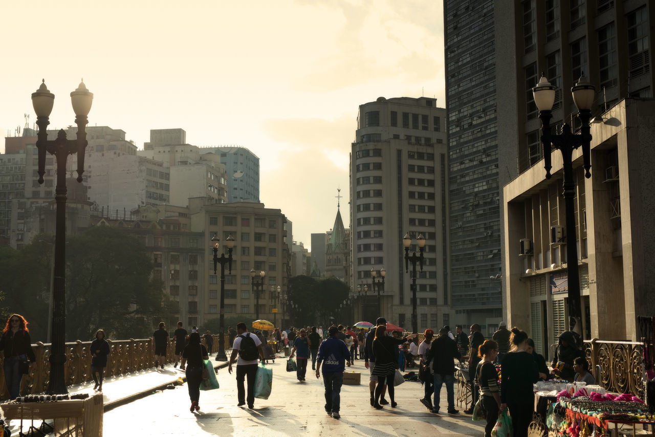 GROUP OF PEOPLE ON CITY STREET