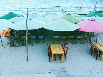 Chairs on beach during winter